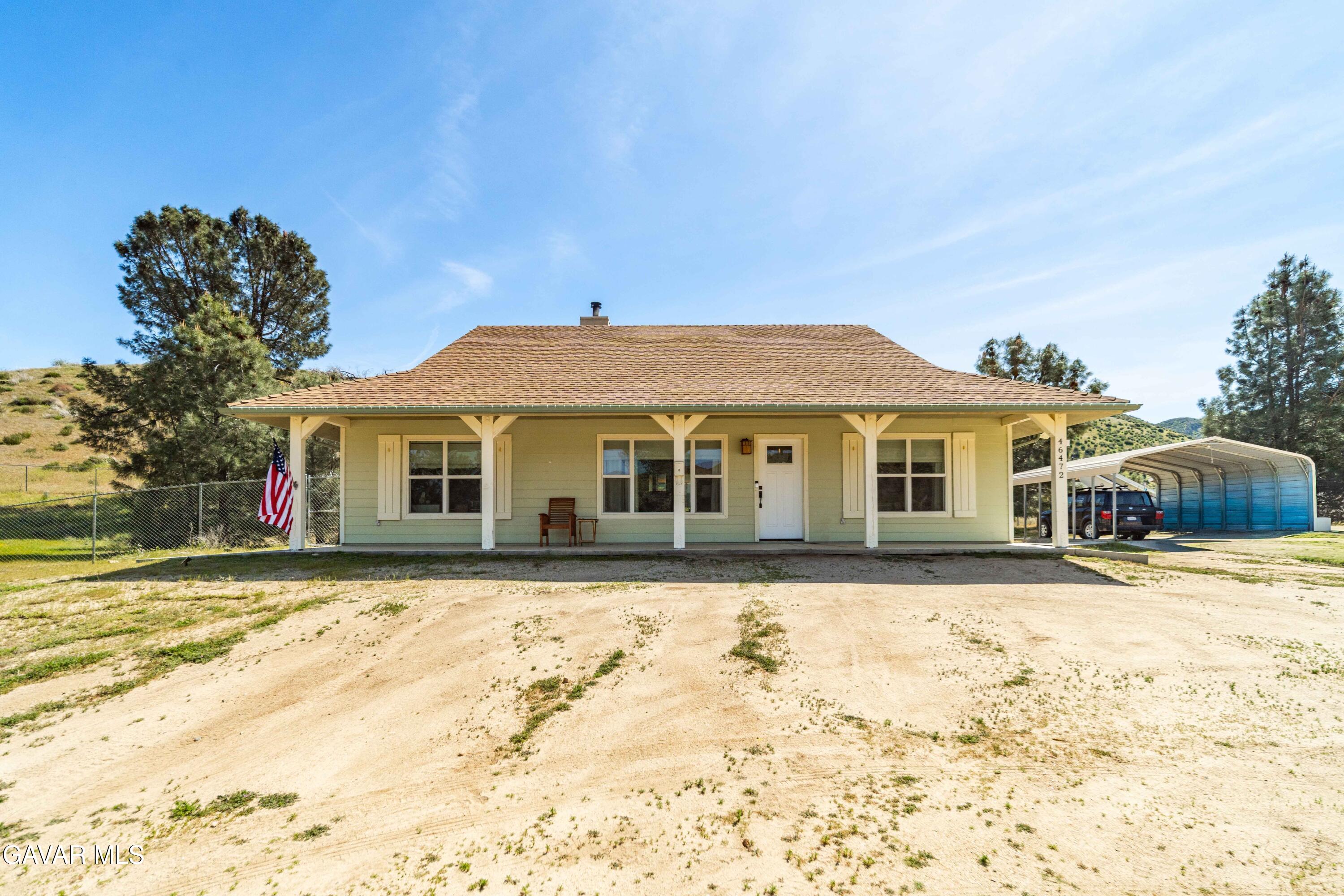 46472 Kings Canyon Road Lancaster, CA 93536 - Photo 2 of 33 a front view of a house with a yard