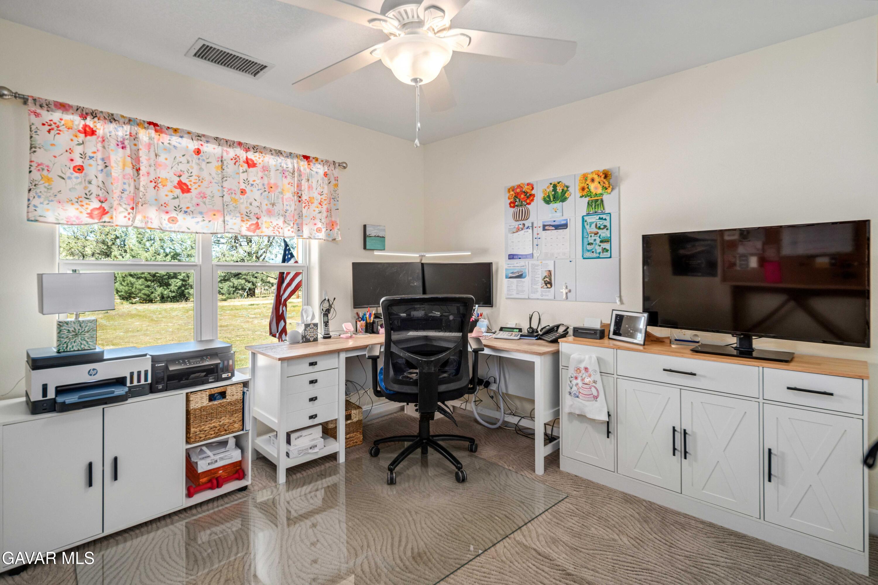 46472 Kings Canyon Road Lancaster, CA 93536 - Photo 23 of 33 a view of a workspace with furniture and a window
