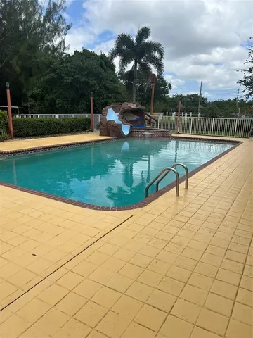 a view of outdoor space with deck and yard