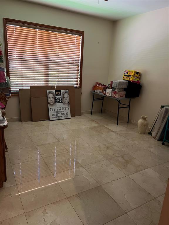 11301 Southwest 3rd Street Plantation, FL 33325 - Photo 20 of 24 a bedroom with a bed and a window