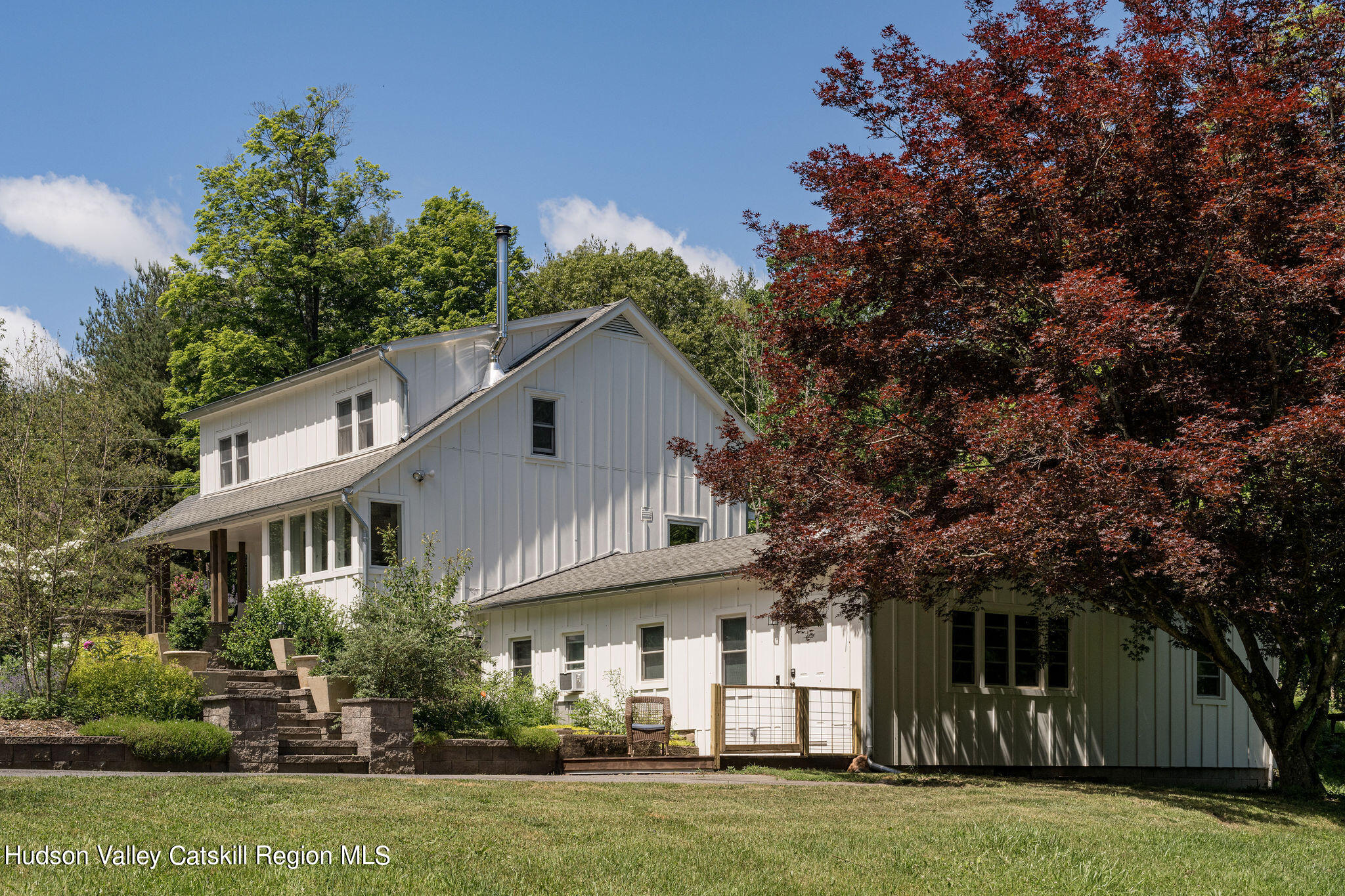 18 Vly Atwood Road Stone Ridge, NY 12484 - Photo 3 of 37 a view of a white house with a big yard and large trees