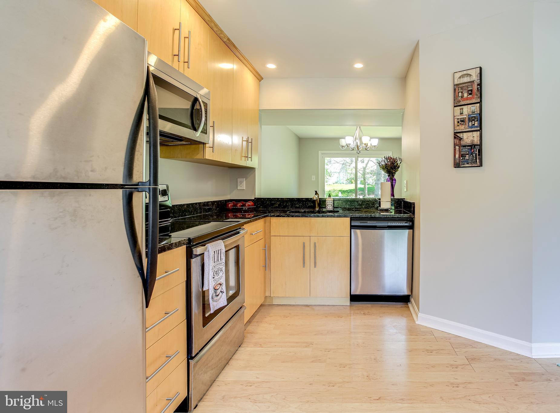 9466 Clocktower Lane Columbia, MD 21046 - Photo 6 of 44 The kitchen opens to living room