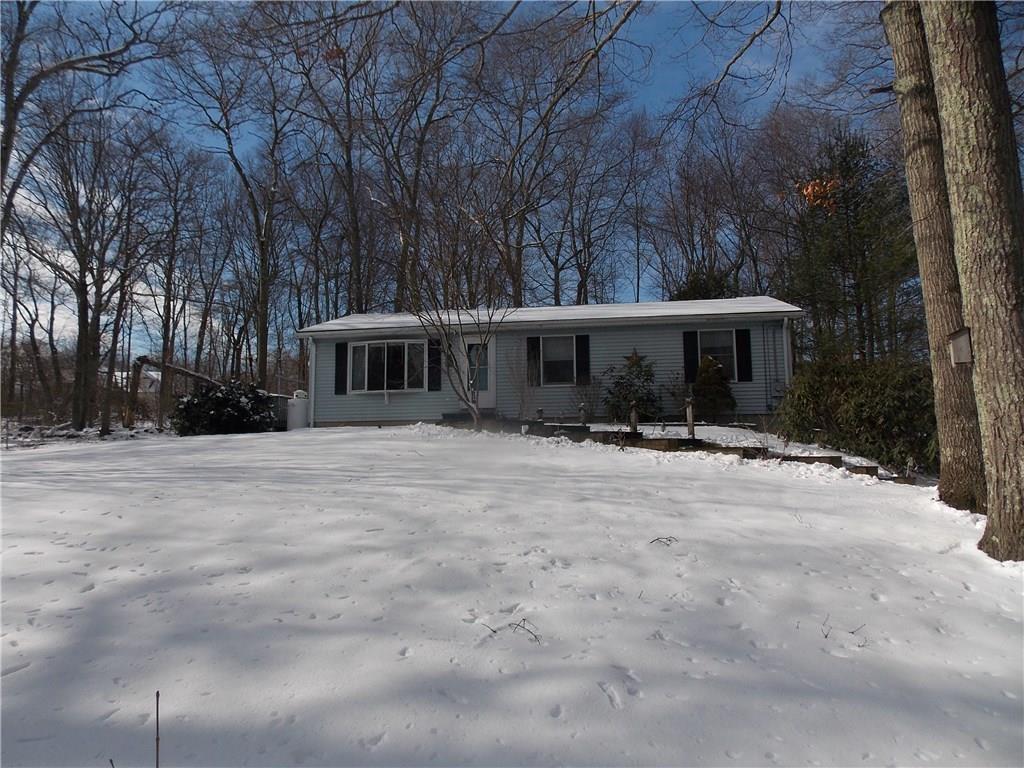 897 Killingworth Road Haddam, CT 06441 - Photo 1 of 1 a front view of a house with a yard and trees