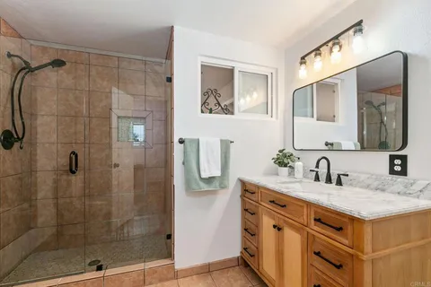 a view of room with furniture and wooden floor
