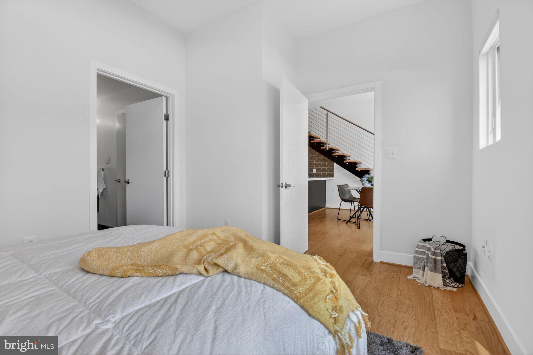 1443 Chapin Street Northwest, Unit 403 Washington, DC 20009 - Photo 12 of 24 a bedroom with a bed and a table