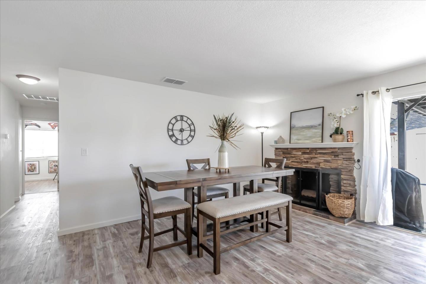 5075 Eppling Lane San Jose, CA 95111 - Photo 18 of 60 a view of a dining room with furniture and wooden floor
