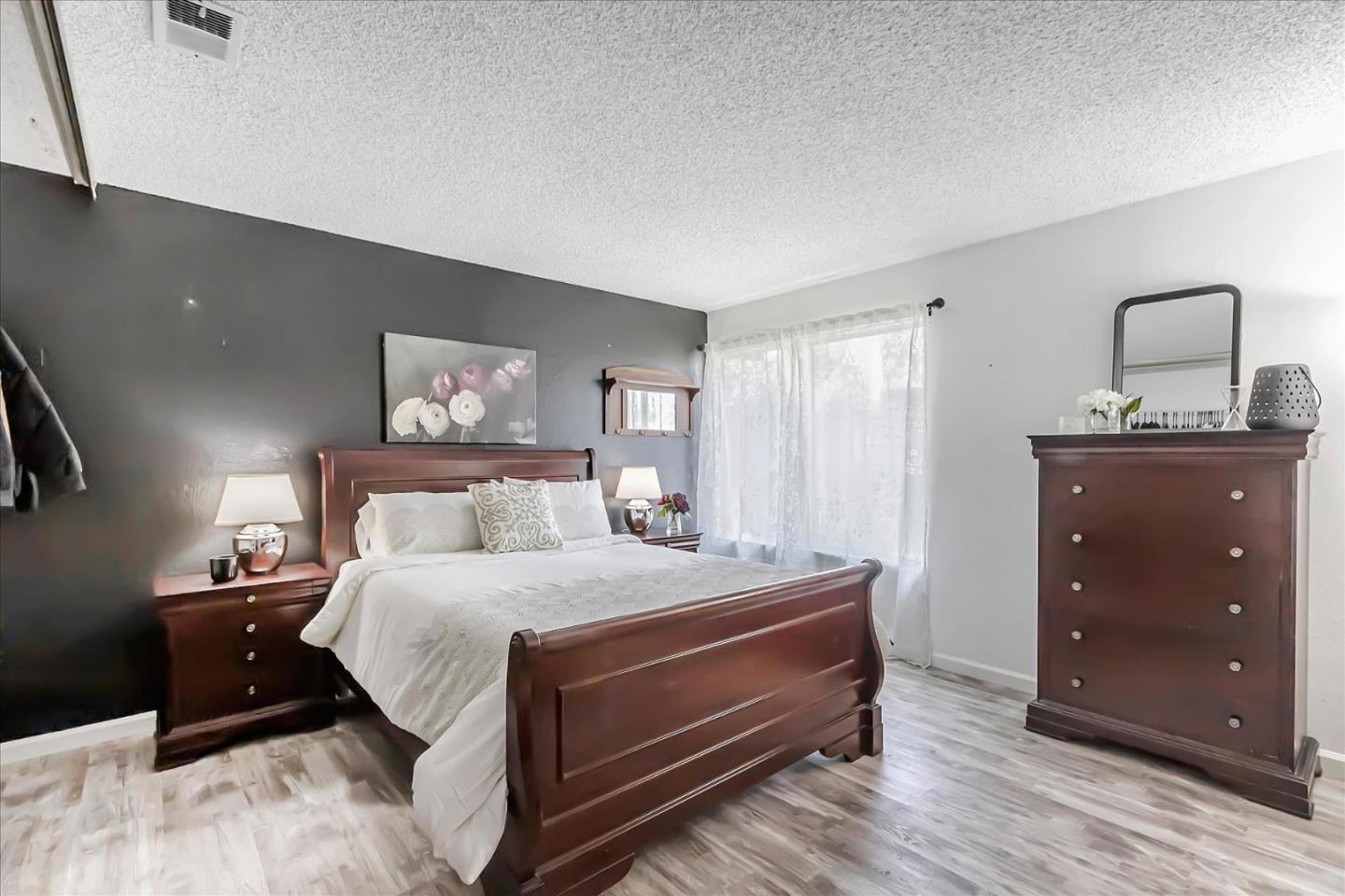 5075 Eppling Lane San Jose, CA 95111 - Photo 24 of 60 a bedroom with a bed and a dresser