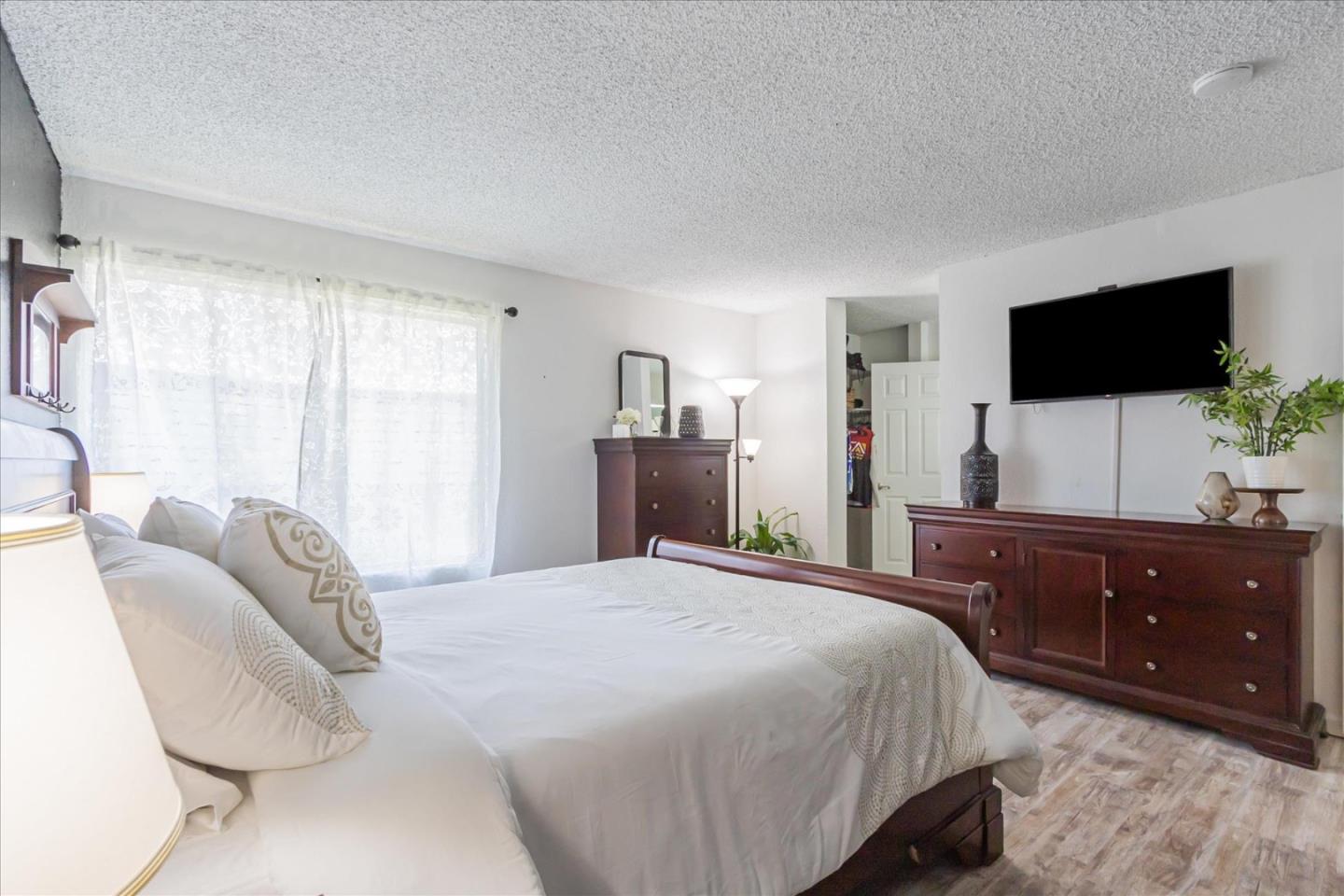 5075 Eppling Lane San Jose, CA 95111 - Photo 27 of 60 a bedroom with a bed and a television
