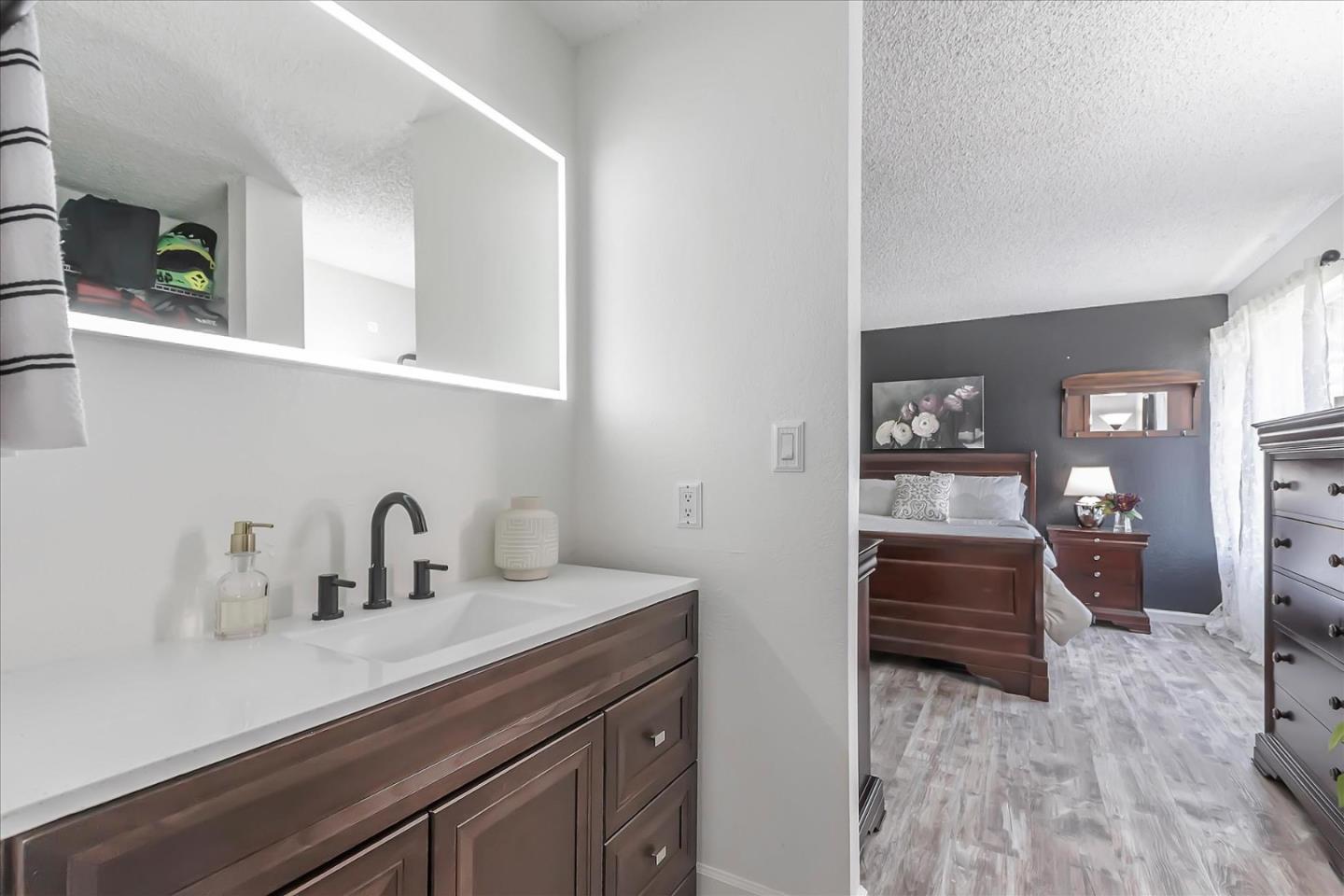 5075 Eppling Lane San Jose, CA 95111 - Photo 28 of 60 a kitchen with a sink and a refrigerator