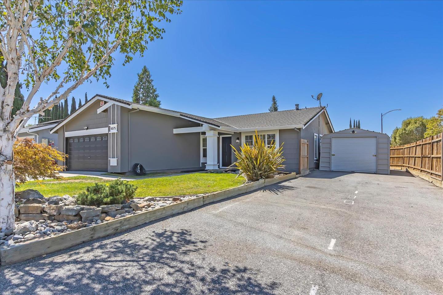 5075 Eppling Lane San Jose, CA 95111 - Photo 5 of 60 a front view of a house with a yard