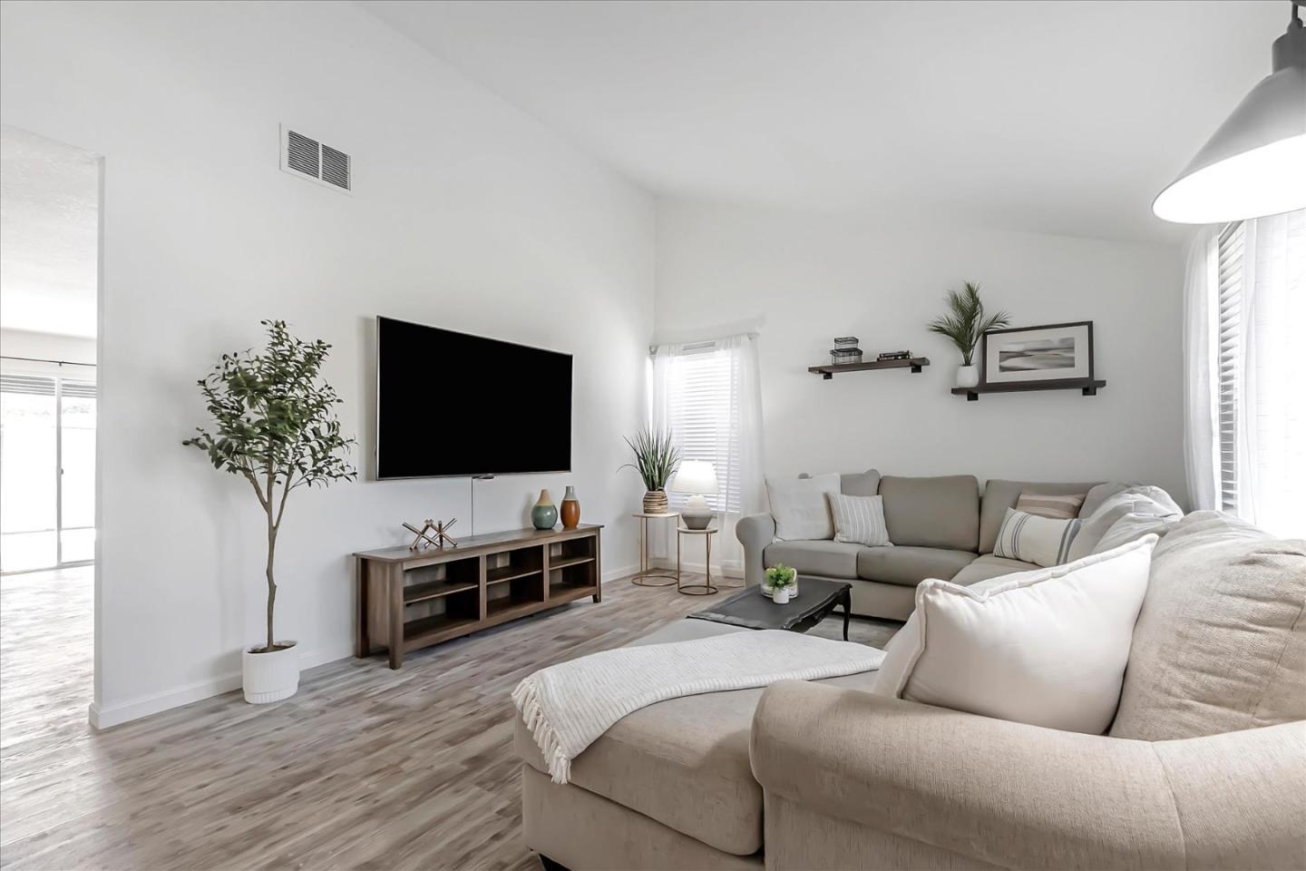 5075 Eppling Lane San Jose, CA 95111 - Photo 7 of 60 a living room with furniture and a flat screen tv