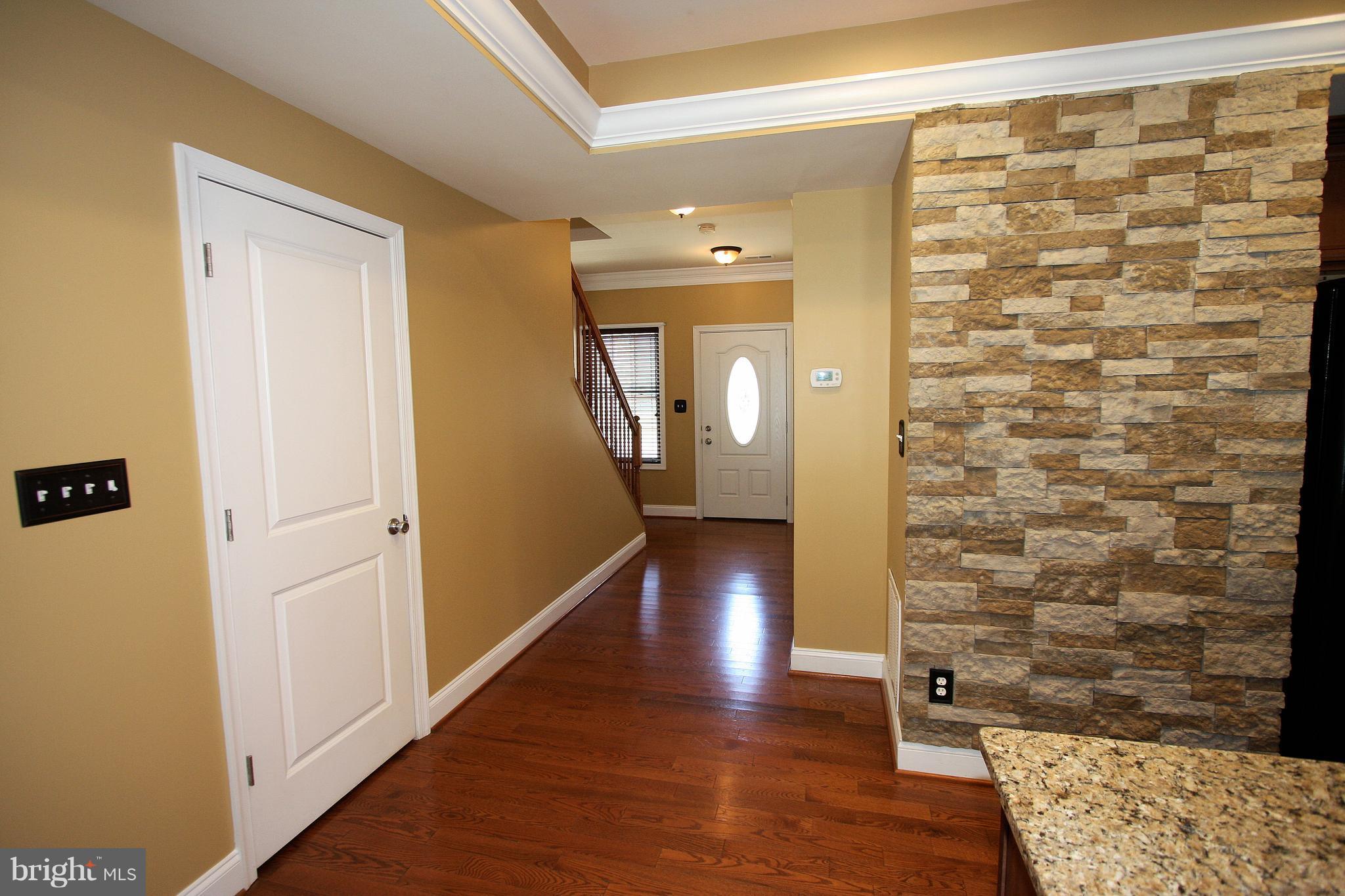 234 Carvel Road Pasadena, MD 21122 - Photo 5 of 30 Stacked stone in kitchen/greatroom.