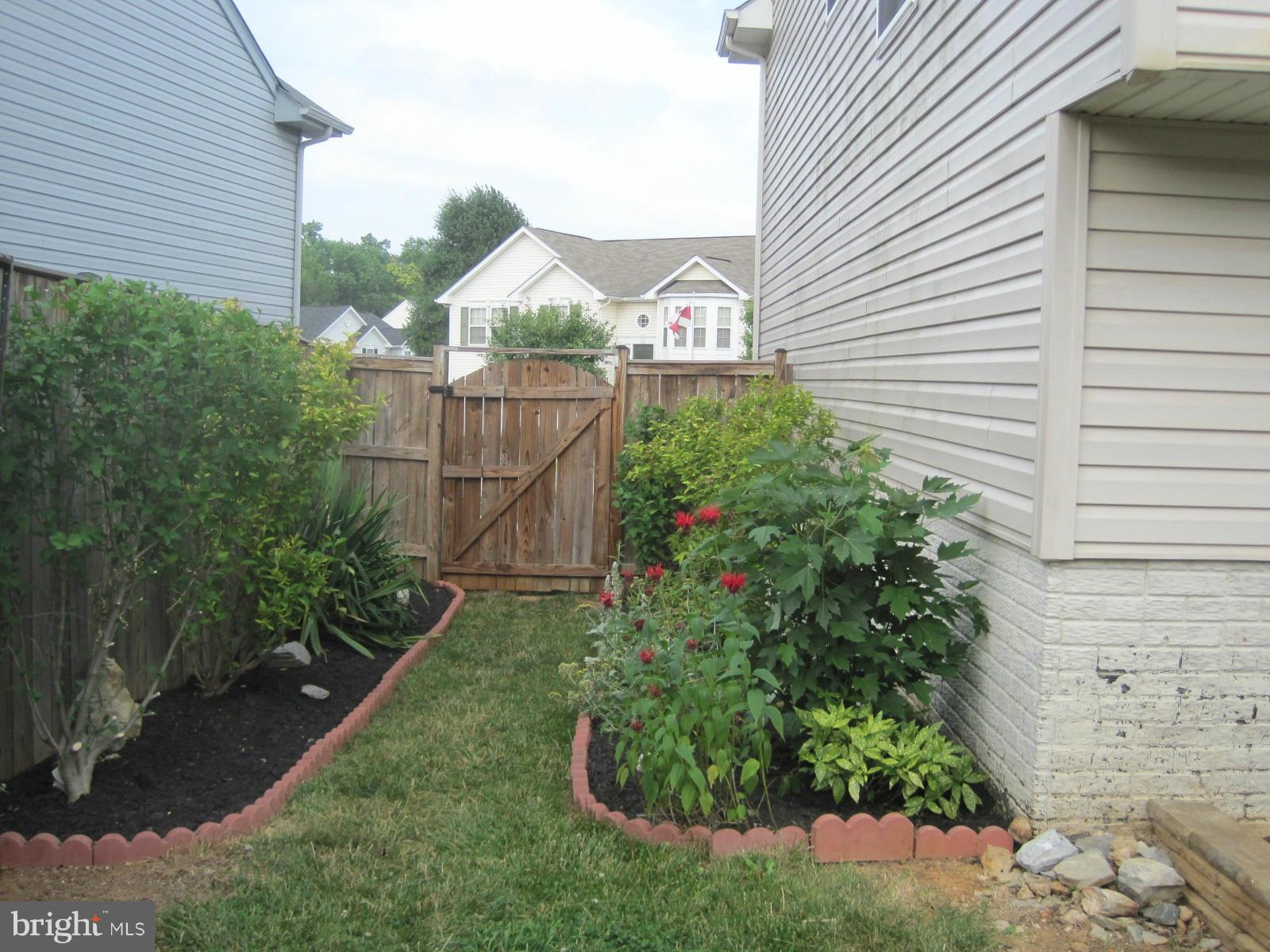 172 Ranson Estates Circle Ranson, WV 25438 - Photo 18 of 22 Right side yard well landscaped