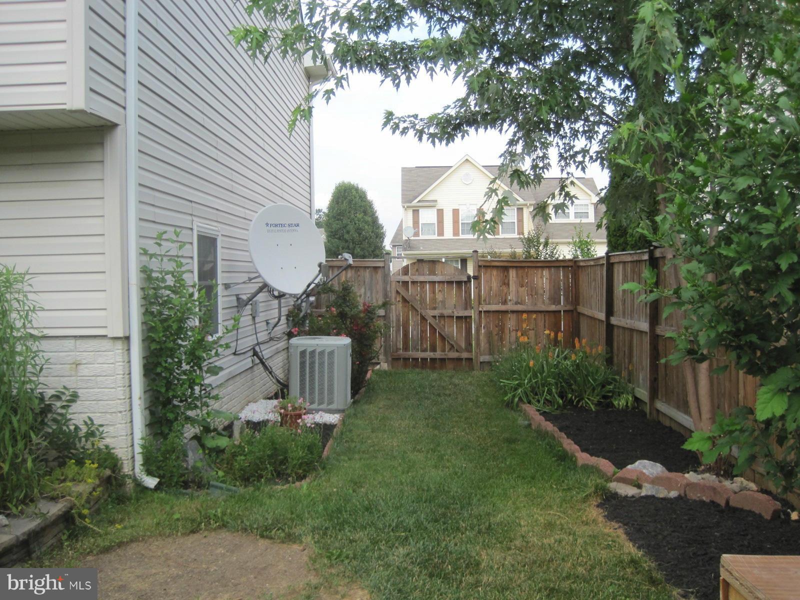 172 Ranson Estates Circle Ranson, WV 25438 - Photo 19 of 22 Left side yard well landscaped