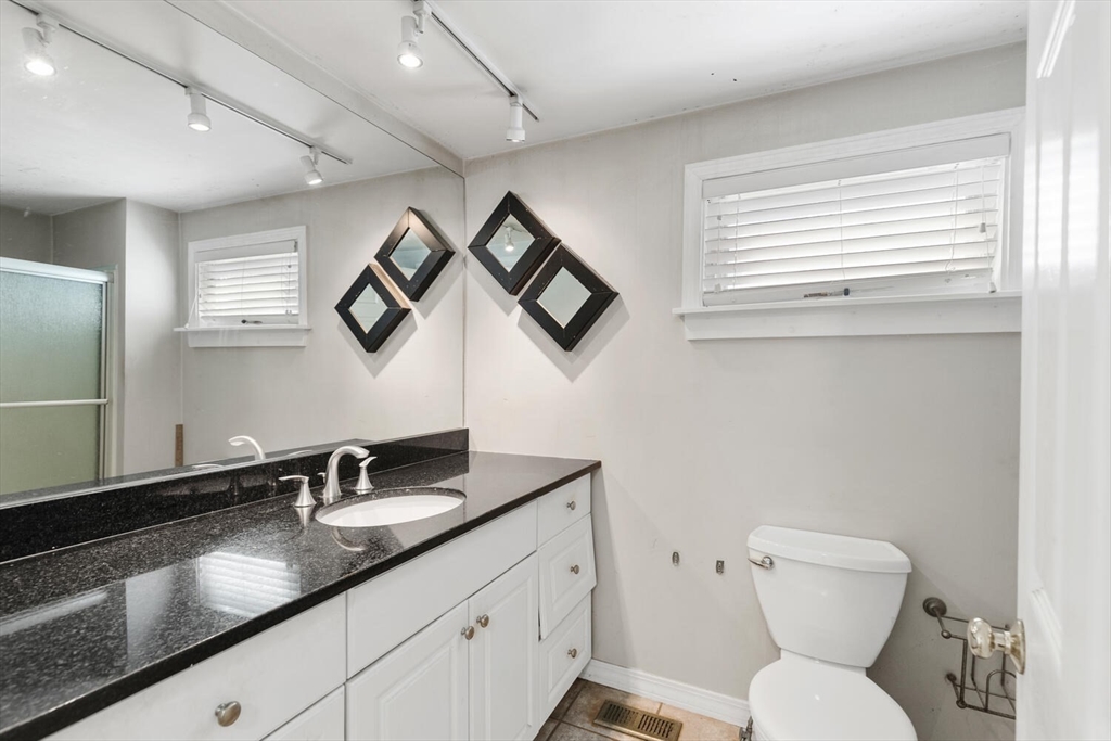 14 Rockwood Road Lynnfield, MA 01940 - Photo 16 of 29 a bathroom with a toilet a sink and mirror