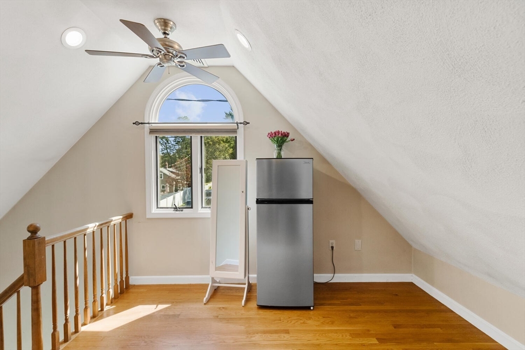 14 Rockwood Road Lynnfield, MA 01940 - Photo 19 of 29 a view of a livingroom with a ceiling fan and wooden floor