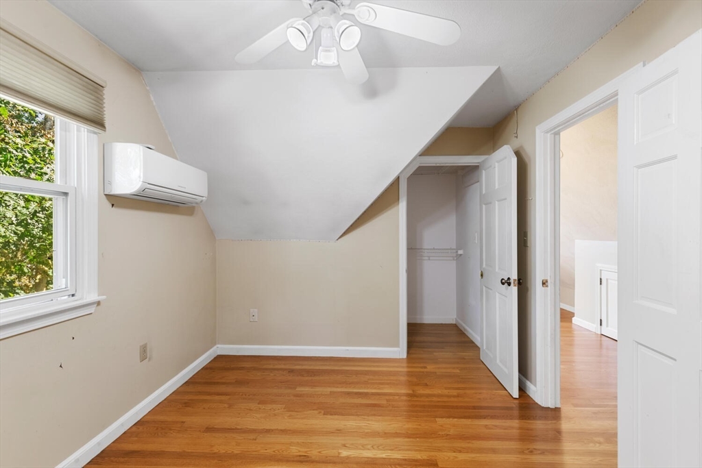 14 Rockwood Road Lynnfield, MA 01940 - Photo 21 of 29 a view of an empty room with wooden floor and a window
