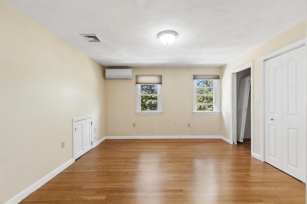 14 Rockwood Road Lynnfield, MA 01940 - Photo 23 of 29 an empty room with wooden floor and windows