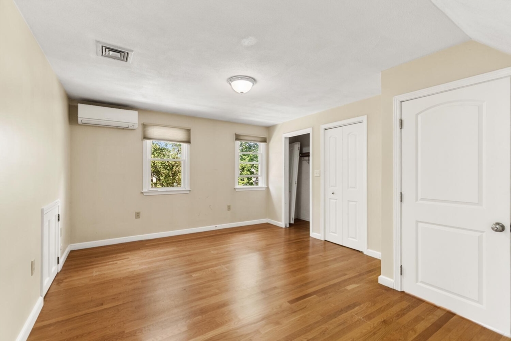 14 Rockwood Road Lynnfield, MA 01940 - Photo 24 of 29 an empty room with wooden floor and windows