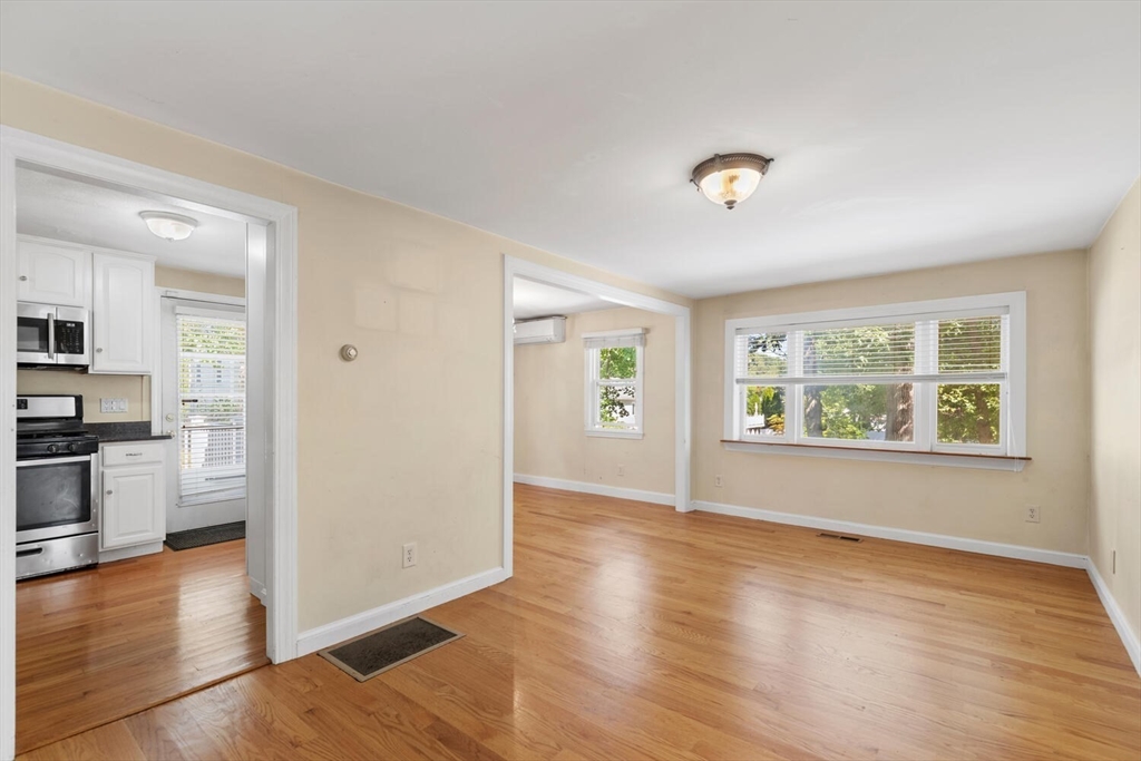 14 Rockwood Road Lynnfield, MA 01940 - Photo 4 of 29 an empty room with wooden floor and windows