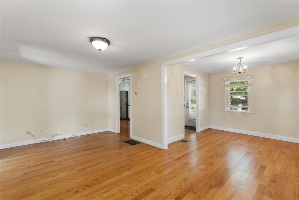 14 Rockwood Road Lynnfield, MA 01940 - Photo 5 of 29 an empty room with wooden floor and windows