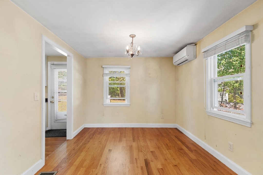 14 Rockwood Road Lynnfield, MA 01940 - Photo 6 of 29 a view of an empty room with wooden floor and a window