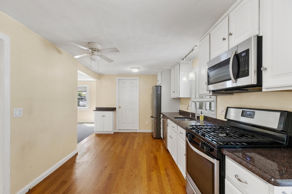 14 Rockwood Road Lynnfield, MA 01940 - Photo 8 of 29 a kitchen with stainless steel appliances granite countertop a stove and a refrigerator