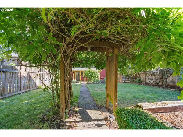 a backyard of a house with lots of green space