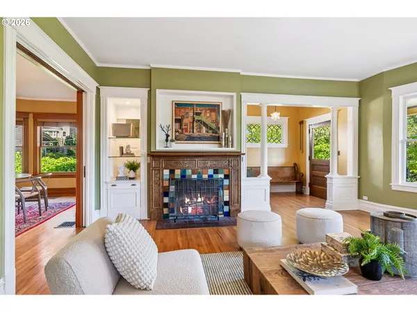 a living room with furniture and a fireplace