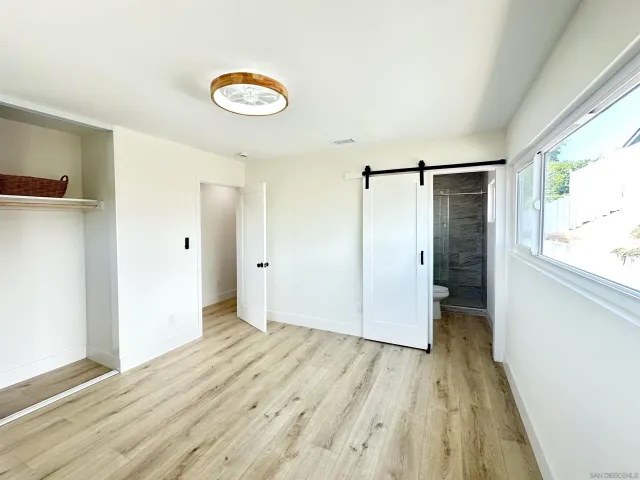 a view of a livingroom with wooden floor