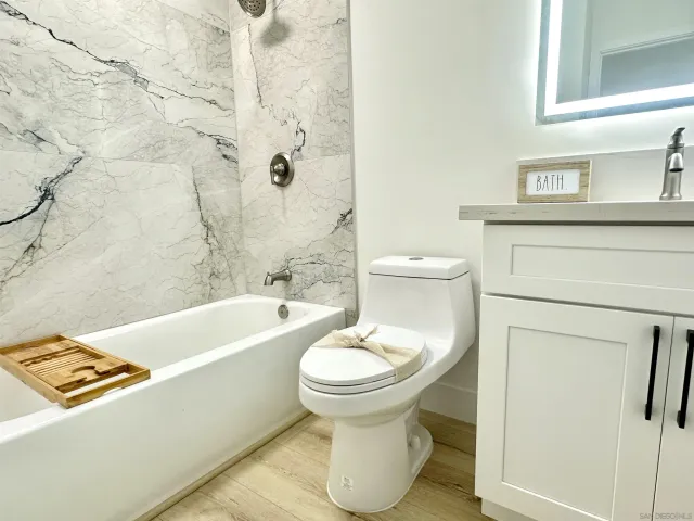 a bathroom with a sink a toilet and a bathtub