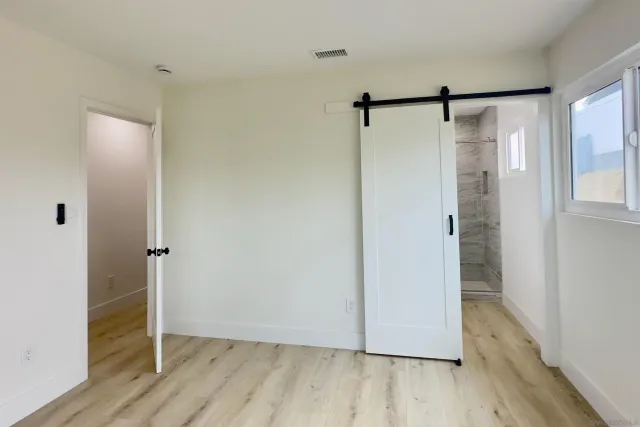 a view of bathroom with a glass shower door