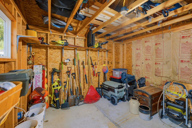 5196 Rodeo Circle Oakley, UT 84055 - Photo 52 of 57 Utility building interior with exposed wood framing, oriented strand board walls, and concrete flooring