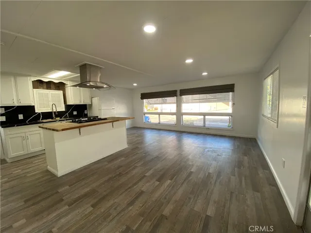 a view of a kitchen with microwave and cabinets