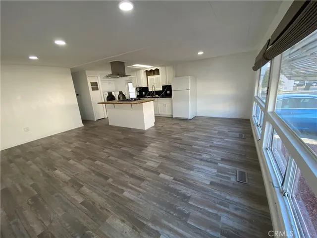 a view of kitchen with cabinets and wooden floor