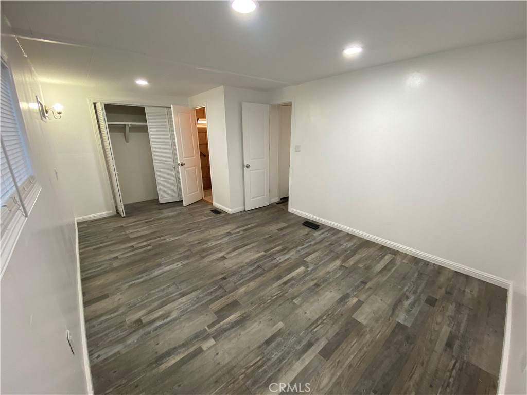 35 Orange Via Anaheim, CA 92801 - Photo 15 of 21 an empty room with wooden floor and windows