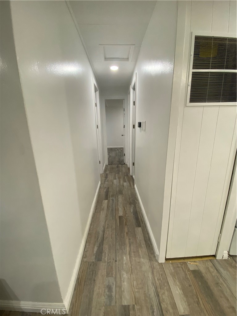 35 Orange Via Anaheim, CA 92801 - Photo 16 of 21 a view of a hallway with wooden floor