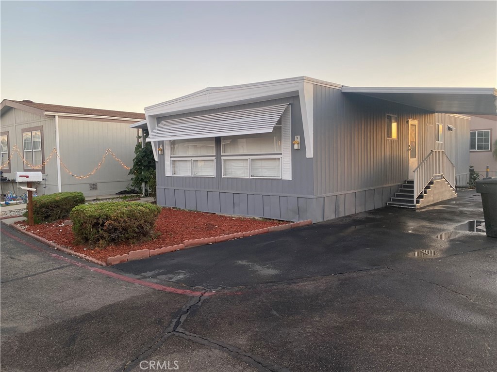 35 Orange Via Anaheim, CA 92801 - Photo 2 of 21 a front view of a house with a yard