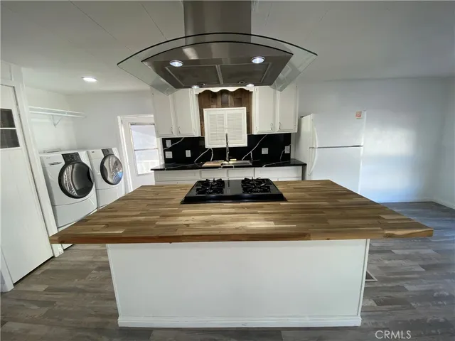 a view of kitchen island with wooden floor