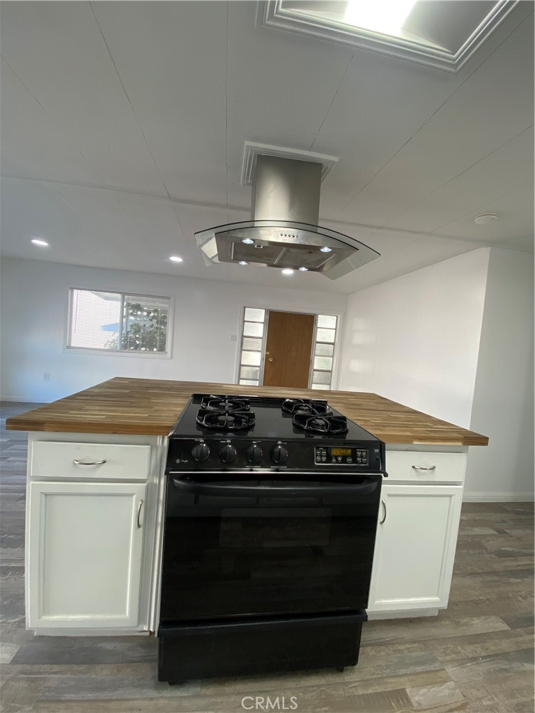 35 Orange Via Anaheim, CA 92801 - Photo 9 of 21 a stove top oven sitting inside of a kitchen