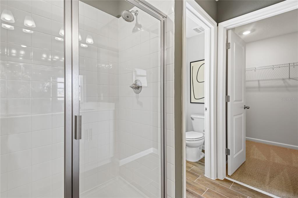5319 Spring Maiden Circle Apollo Beach, FL 33572 - Photo 14 of 25 a bathroom with a shower and a glass door