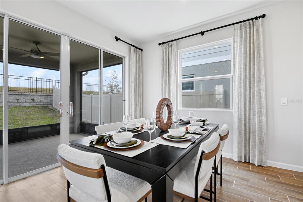 5319 Spring Maiden Circle Apollo Beach, FL 33572 - Photo 8 of 25 a dining room with furniture and window