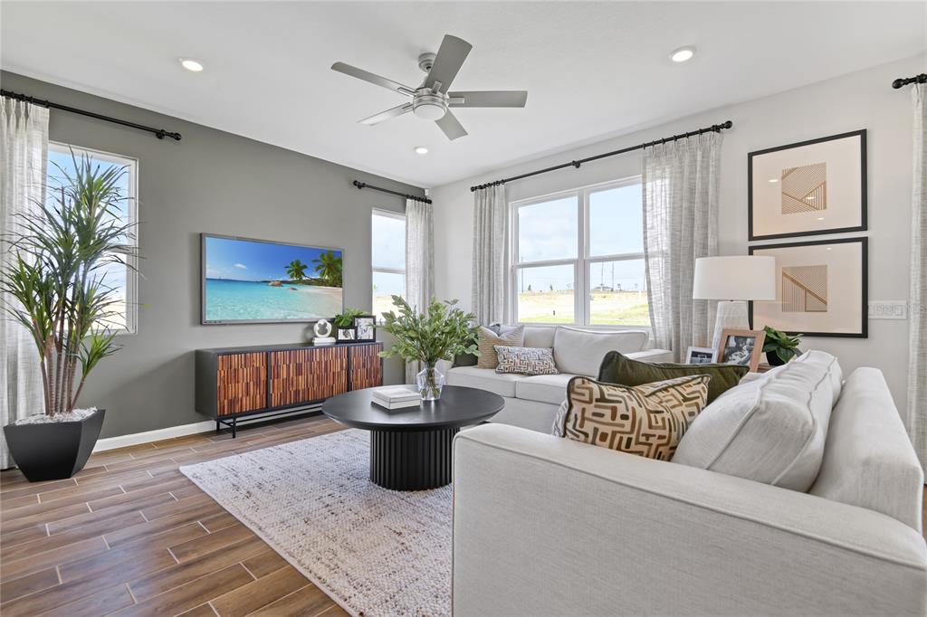 5319 Spring Maiden Circle Apollo Beach, FL 33572 - Photo 9 of 25 a living room with furniture potted plant and a window