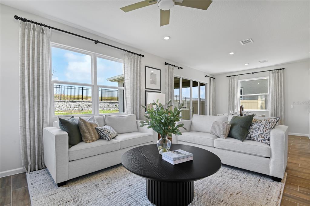 5319 Spring Maiden Circle Apollo Beach, FL 33572 - Photo 10 of 25 a living room with furniture potted plant and a large window