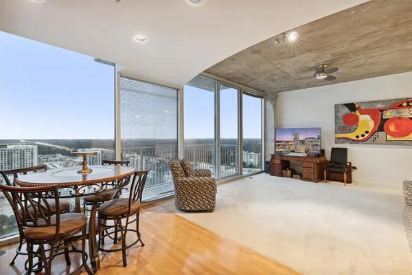 a bedroom with furniture and a flat screen tv