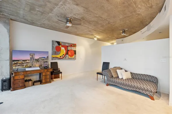 a bathroom with a granite countertop sink a toilet and a mirror
