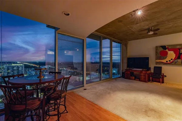 a view of a dining room with furniture and chandelier