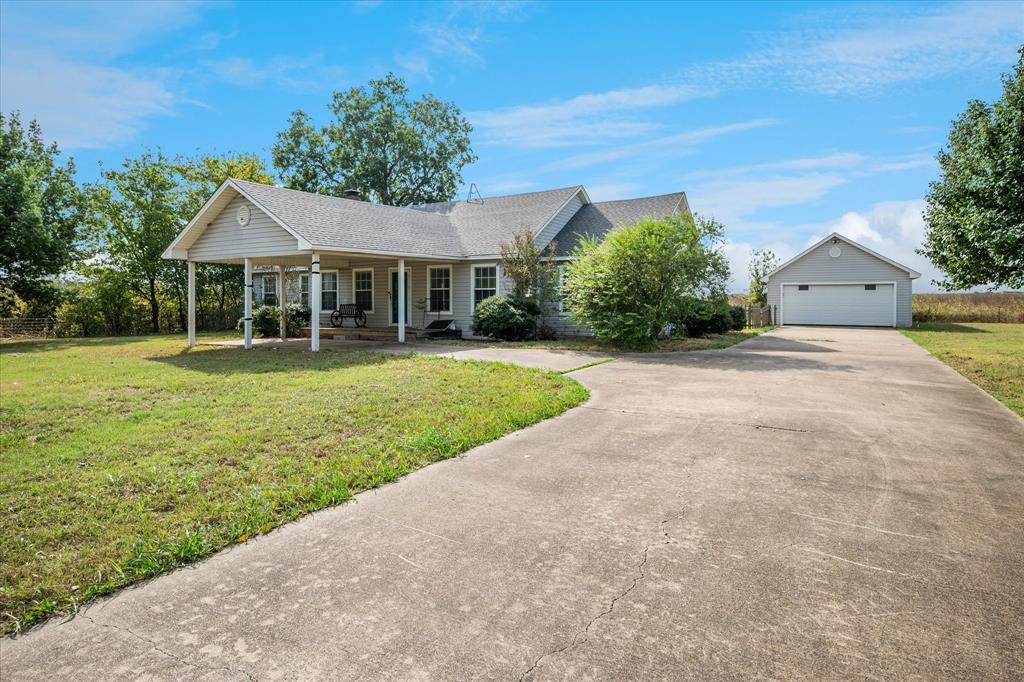 9828 County Road Alvarado, TX 76009 - Photo 1 of 20 a front view of a house with a yard and garage