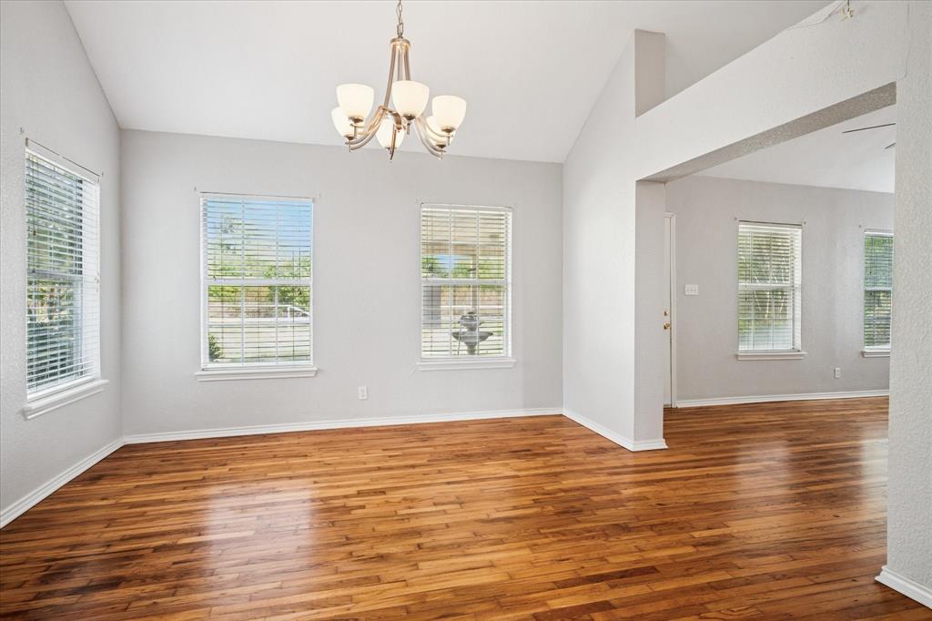 9828 County Road Alvarado, TX 76009 - Photo 3 of 20 a view of an empty room with wooden floor and a window