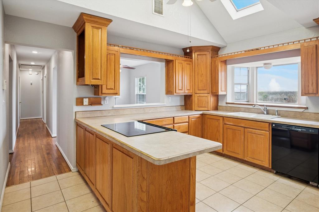 9828 County Road Alvarado, TX 76009 - Photo 5 of 20 a kitchen with stainless steel appliances granite countertop a sink and a stove